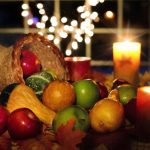Beautiful Thanksgiving cornicopia filled with apples, squashes and pumpkins