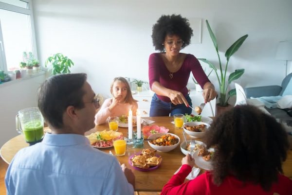 Family at Dinner table enjoying home cooked meal